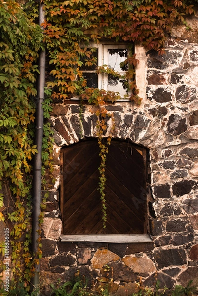 Fototapeta old stone wall with windows