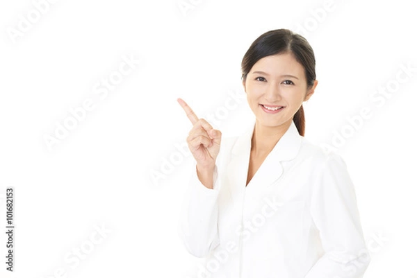 Fototapeta 指示する笑顔の女性