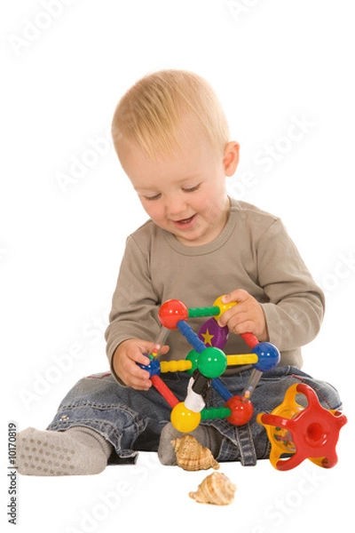 Fototapeta little boy play with toys. isolated on a white background