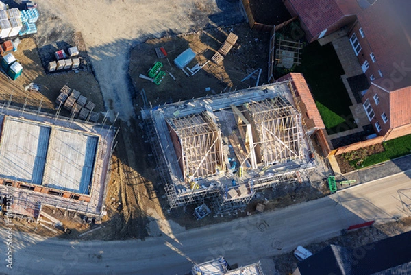 Obraz Aerial view of UK house construction in the building industry, housing crisis, sustainable future