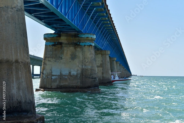 Obraz Blue bridge spanning ocean