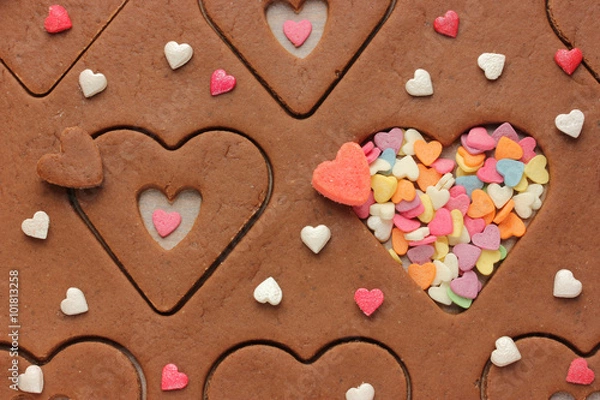 Fototapeta Cookies in the shape of hearts and sugar sprinkling on Valentine's Day