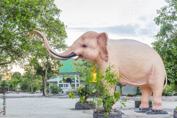 Obraz The Pink Elephant statue and Trees background
