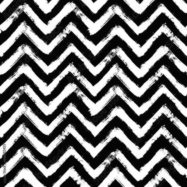 Fototapeta Vector chevron pattern. Seamless black and white brush stroke background. Zig zag print with distress texture. Painted ornament for kids. Childish design