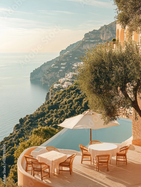 Fototapeta A luxurious cliffside terrace with a pool and umbrellas overlooks a stunning Mediterranean seascape beneath the warm sun.