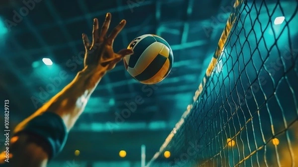Fototapeta Close-up of a volleyball player's hand reaching for the ball during a game.