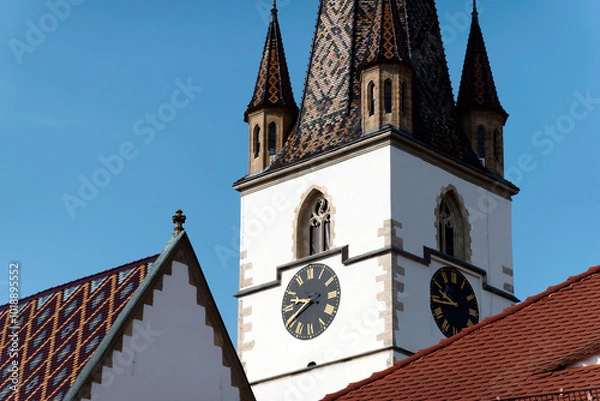 Fototapeta Fragment from the clock tower of Lutheran Cathedral of Saint Mary. It is a prominent landmark in Sibiu, Romania, one of the largest Gothic-style churches in Transylvania. 