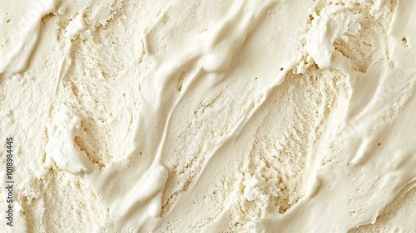 Fototapeta close-up texture of vanilla flavor gelato, featuring the beige surface in a full-frame background, ideal for food banners and showcasing the smooth and creamy indulgence of ice cream