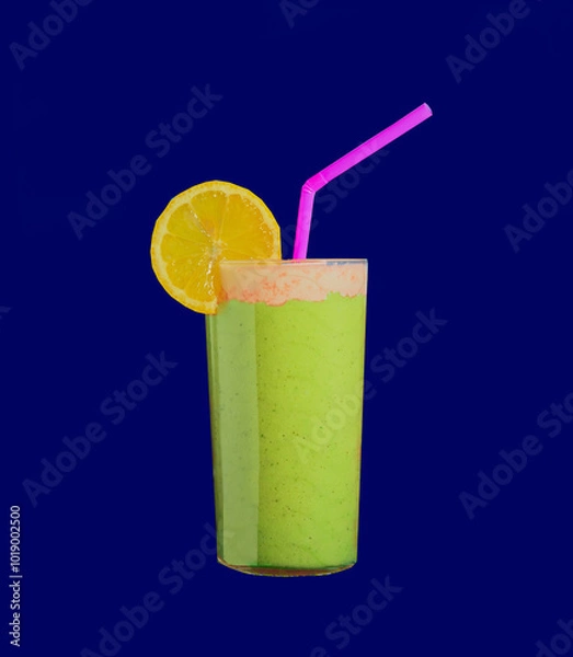 Obraz Vibrant smoothie on a blue background.