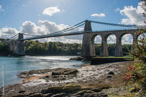 Fototapeta A view of the historic Menai suspension bridge spanning the Mena