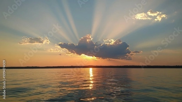 Obraz Sun peeking from behind a cloud at the lake.