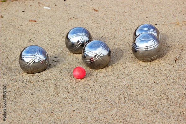 Obraz Petanque balls on the sandy beach 