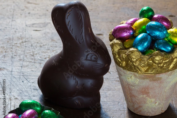 Fototapeta easter eggs and a chocolate rabbit