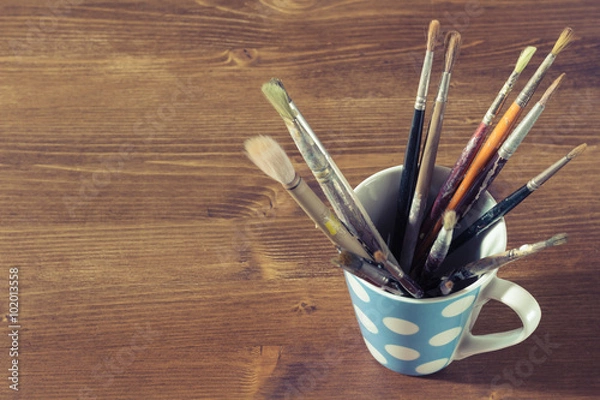 Obraz old paintbrushes in a mug or cup