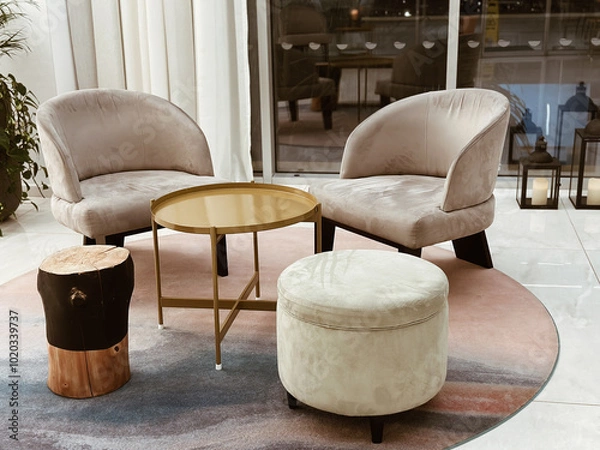 Fototapeta two soft chairs and table in the hotel lobby