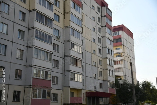 Fototapeta Cityscape of Russia. Panel house of the Soviet Union, old architecture of the building in the brutalism style