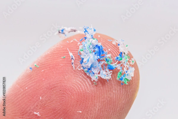 Fototapeta finger close-up with traces of plastic and microplastic