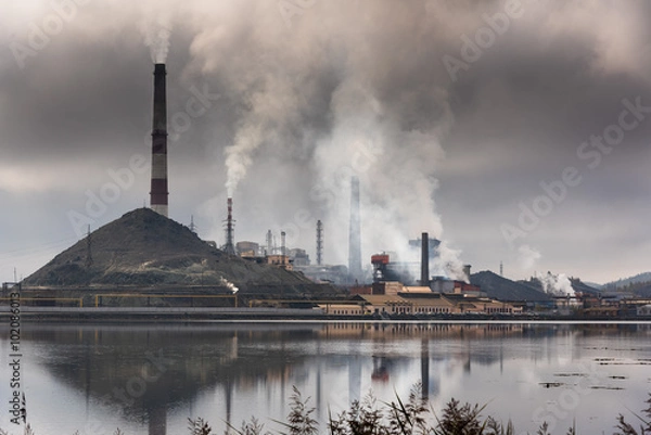 Obraz Silhouette of factory with chimneys and heavy smoke