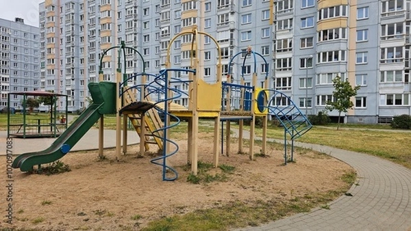 Fototapeta A public outdoor playground with various exercise equipment.