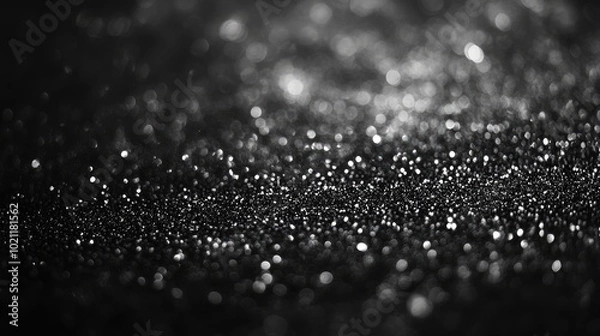 Fototapeta Abstract close-up of sparkling water droplets on a dark surface, creating a mysterious and enchanting atmosphere.