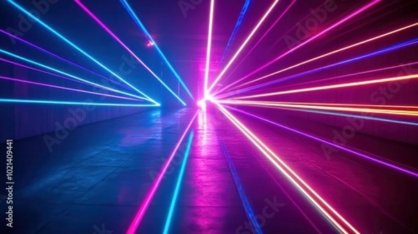 Fototapeta A vibrant display of colorful laser lights in a dark tunnel creating dynamic visual effects.