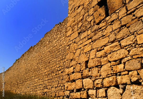 Obraz Stone wall at sunset