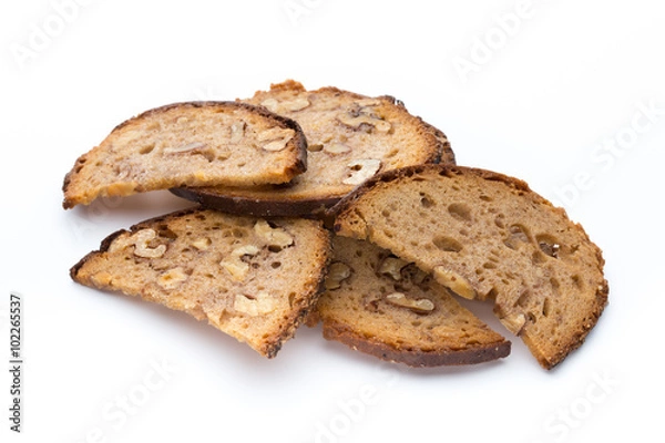 Fototapeta Rye bread crisps with walnuts.