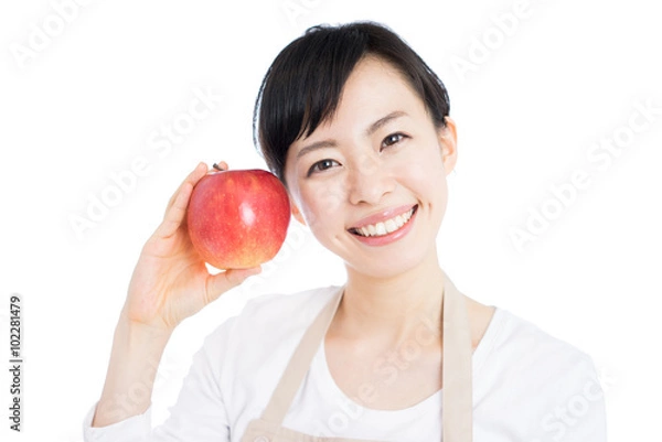 Fototapeta りんごを持った女性