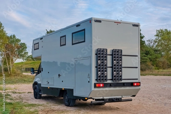 Fototapeta Off road camper 4x4, rv motor home on nature. Travel with motorhome truck. 4x4 mobile home.