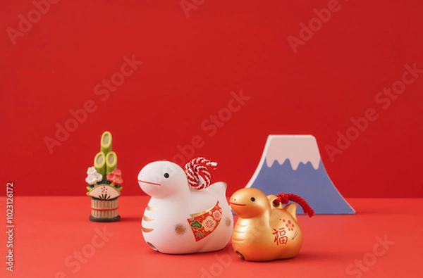 Obraz Japanese new year. Zodiac Snake. Snake ornaments and Mt.Fuji and kadomatsu on the red background. 日本のお正月。干支の巳（ヘビ）。赤背景上の巳の置物と富士山と門松。