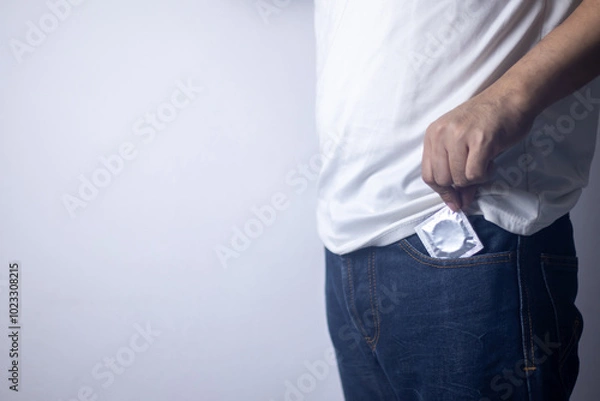 Obraz The man pulled out a condom from his pants pocket and stood there.