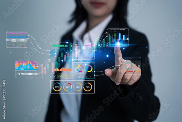 Obraz Businesswoman drawing virtual technical graph and chart for analysis stock market, tax ,technology investment and value investment concept.