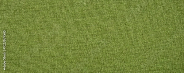 Fototapeta Natural green linen burlap fabric on light green background with copy space for text