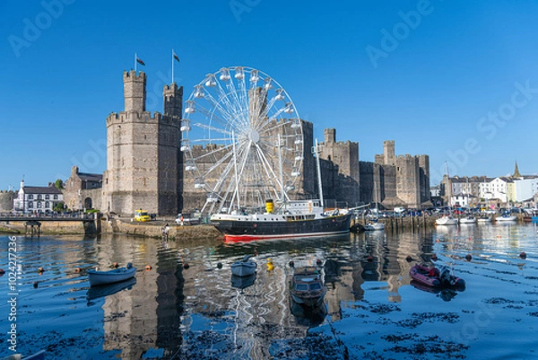 Obraz Caernarfon Castle, Gwynedd, Wales, UK - Caernarfon Castle in North West Wales on then banks of Afon Seiont. Built in 1330 it is now a Unesco World Heritage site.