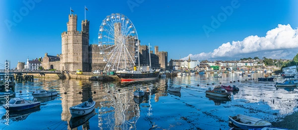 Obraz Caernarfon Castle, Gwynedd, Wales, UK - Caernarfon Castle in North West Wales on then banks of Afon Seiont. Built in 1330 it is now a Unesco World Heritage site.