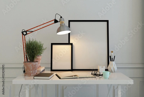 Fototapeta Empty picture frames on a writing desk