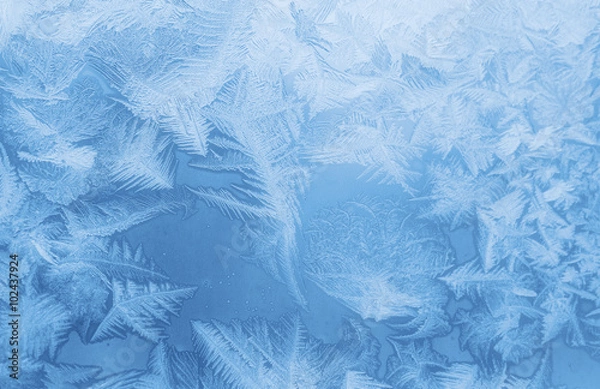Obraz Bright blue frost pattern on a window glass (as an abstract winter background)