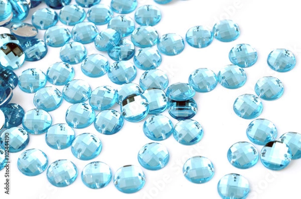 Fototapeta Blue rhinestone on white background