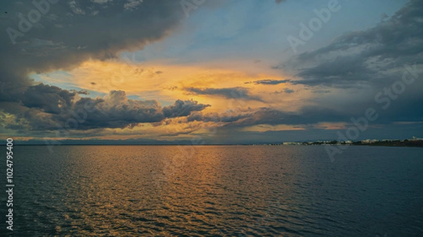 Obraz Cloudy sunset. View from the coast towards sea. Italy.
