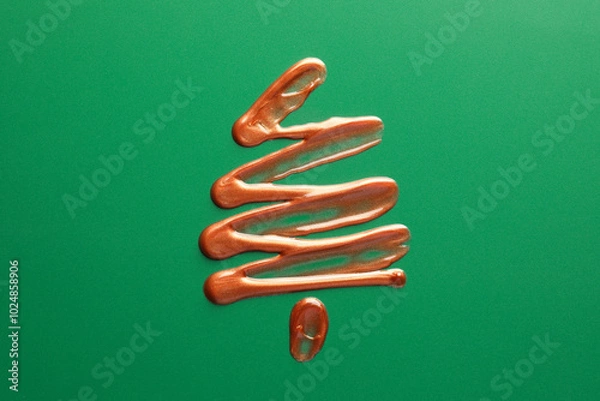 Fototapeta Christmas tree drawn of cosmetic product on green background, top view