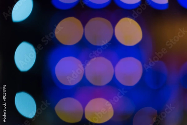 Fototapeta Multicolored defocused bokeh lights background..