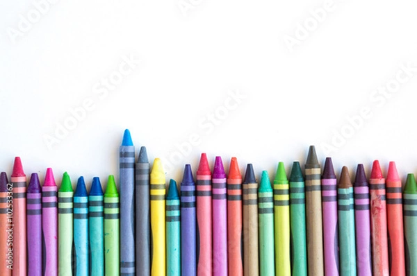 Obraz Crayons and pastels lined up isolated on white background