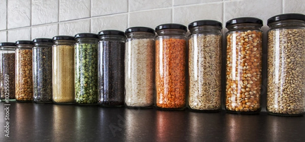 Obraz Health Food - herbs, seeds and pulses in spice jars.