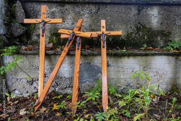 Fototapeta four wooden crosses with Jesus on a defunct hilt