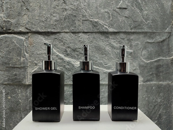 Obraz Black bottles of shower gel, shampoo and conditioner in the bathroom