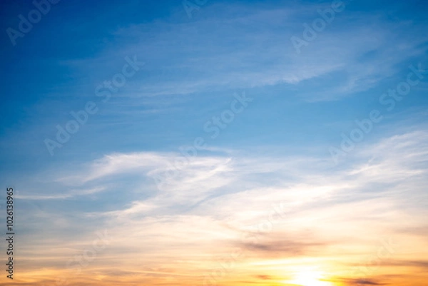 Fototapeta Beautiful , luxury soft gradient orange gold clouds and sunlight on the blue sky perfect for the background, take in everning,Twilight, Large size, high definition landscape photo