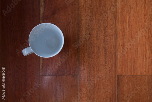 Fototapeta A cups of coffee on orange color wooden table background