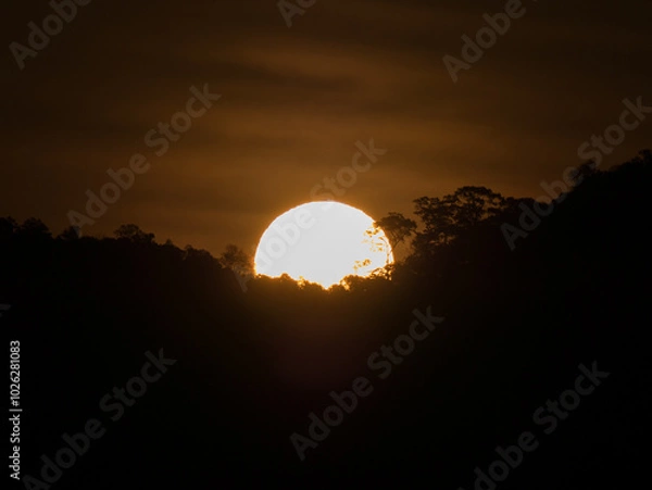 Fototapeta landscape view of sunset above mountain with colorful sky