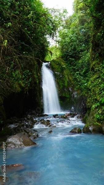 Obraz Water flowing through waterfalls