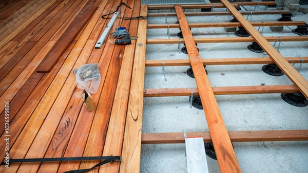 Fototapeta Wooden outside deck construction in progress